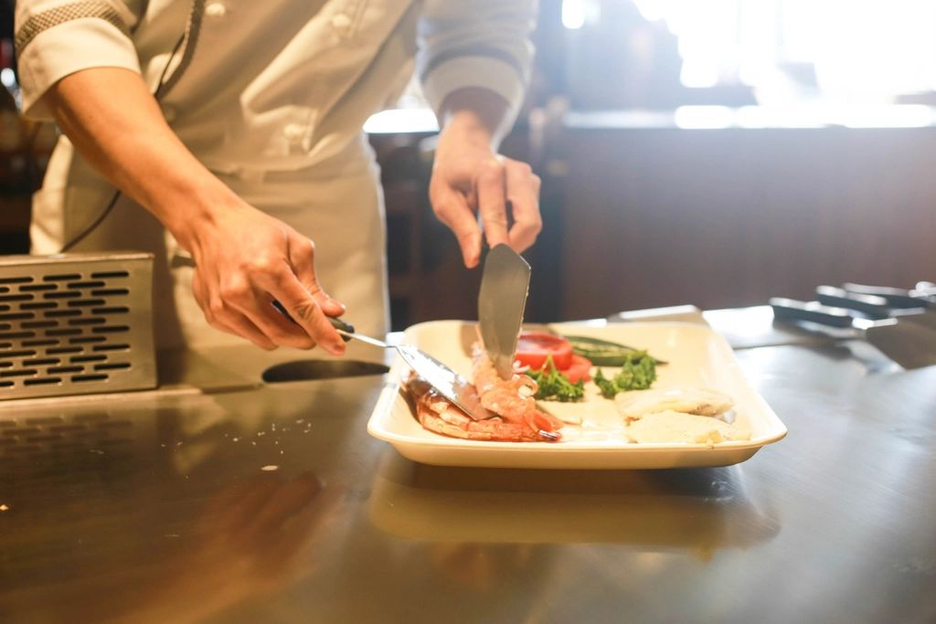 A cook working at the open kitchen