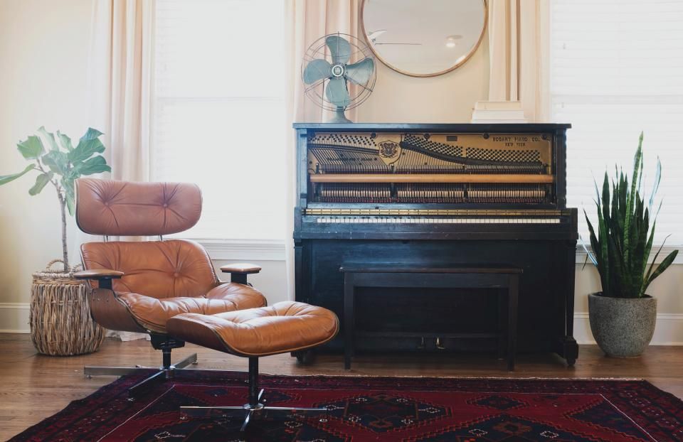 A suite sitting room with a sofa and armchairs